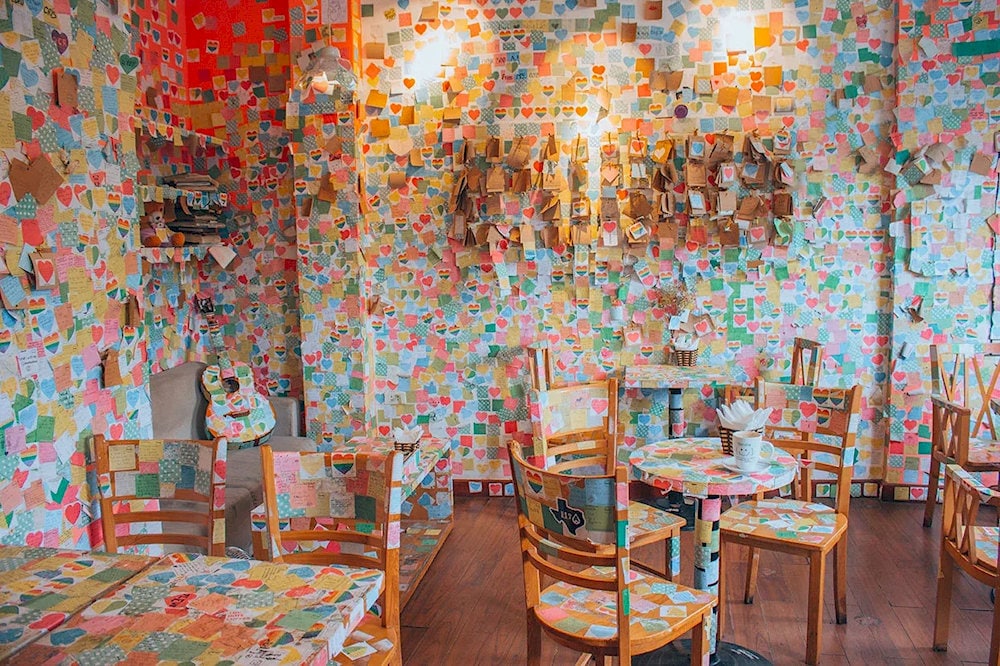 The Note Coffee is a unique space where each corner tells a story through colorful paper notes